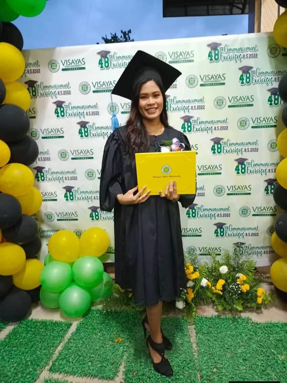 Graduation ceremony photo of Janine Marie