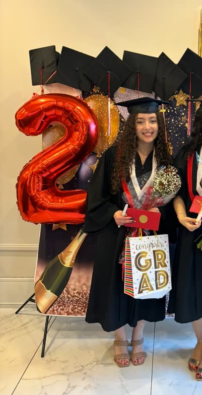 Graduation ceremony photo of Marvelle 