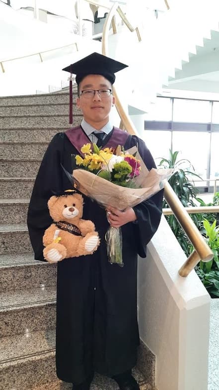 Graduation ceremony photo of Angus 