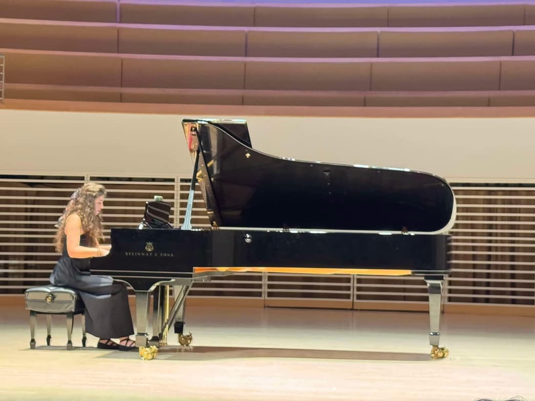 Jonida enjoying a hobby outside teaching