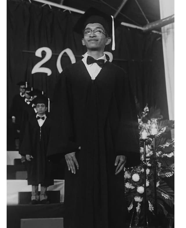 Graduation ceremony photo of Chris 