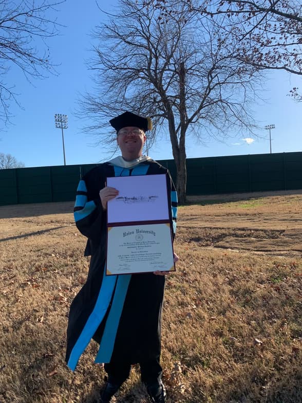 Graduation ceremony photo of Christopher 