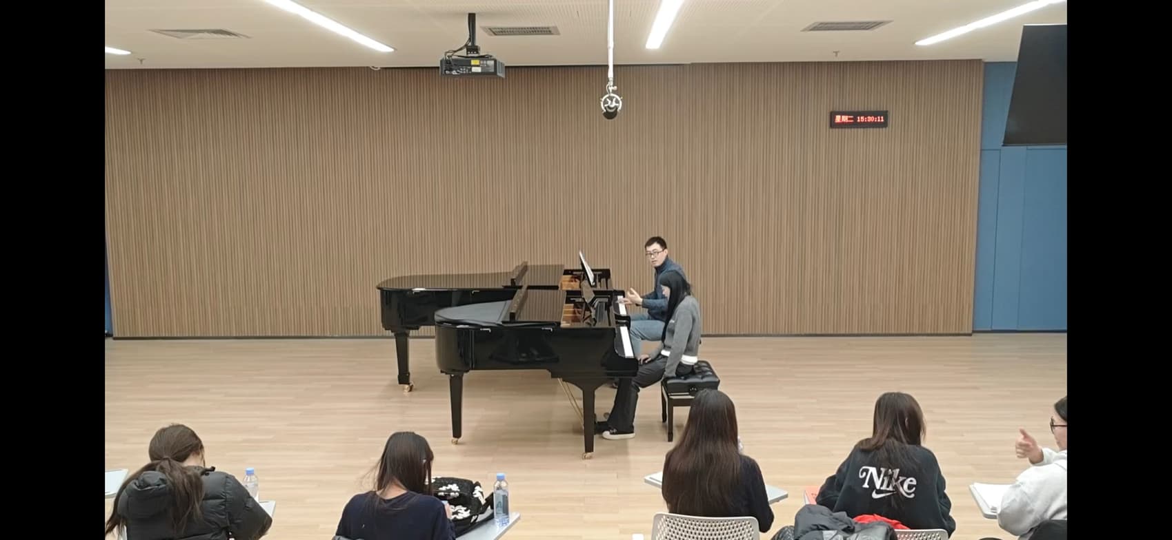 Hao conducting a lesson 