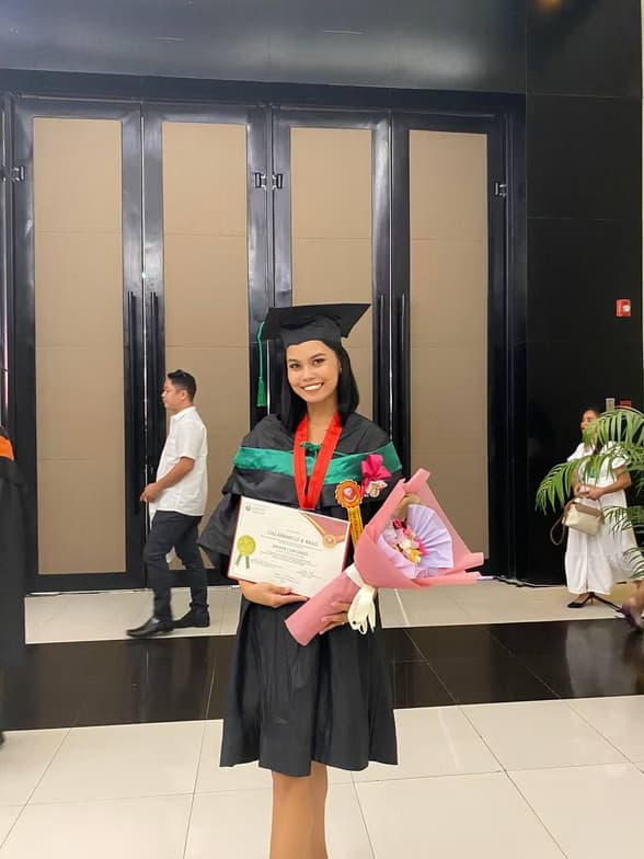 Graduation ceremony photo of Lou Arrabelle
