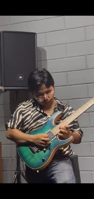 Kiren enjoying a hobby outside teaching