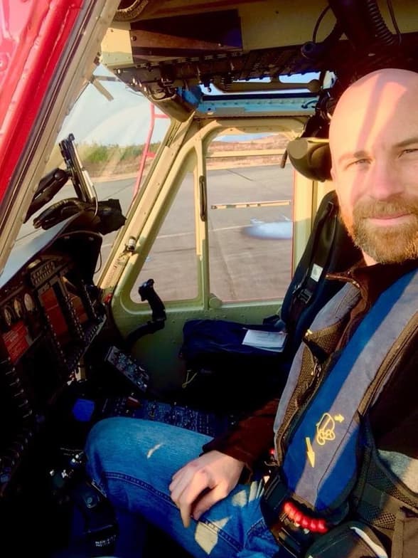 Travisenjoying a hobby outside teaching